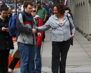 Woman helping a young guy having a complex partial seizure.