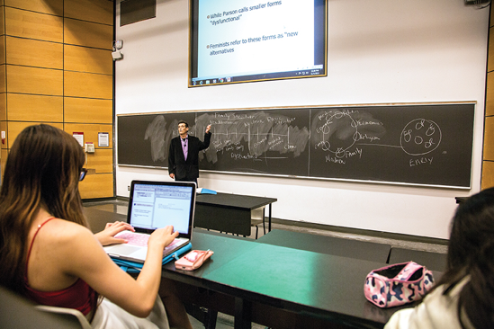 Students taking notes on their computers during class.