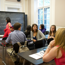 Students having a discussion in a classroom.