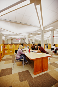 Students having a discussion in the library.